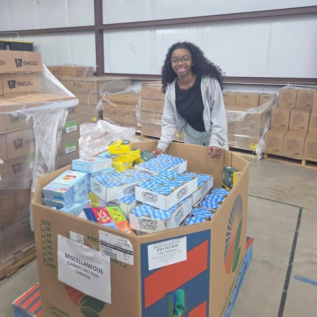 Volunteers stocking the Wylie Christian Care Center food pantry