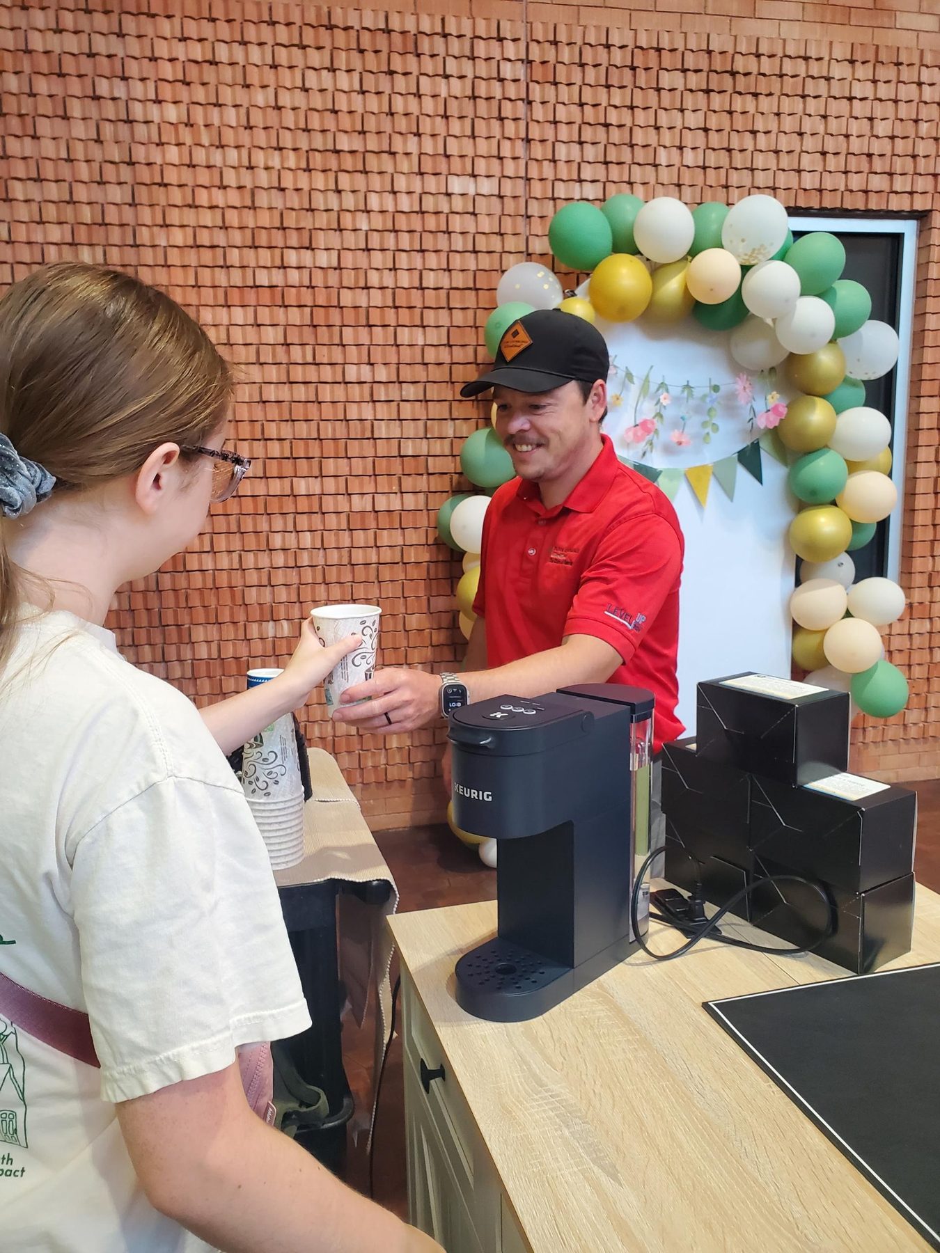 Adulting Well student serving coffee from the cart